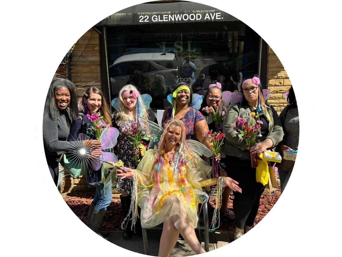 Group of women with fairy wings and fresh bouquets